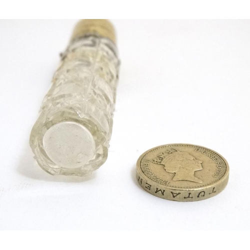 848 - A late Victorian brass topped glass scent bottle with hobnail like cut decoration. the whole 3 3/8''... 