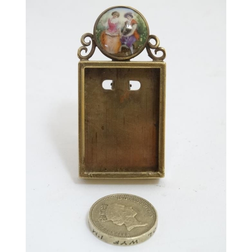 854 - A 19thC miniature easel photograph frame with hand painted cabochon to top. the whole standing 2 3/8... 