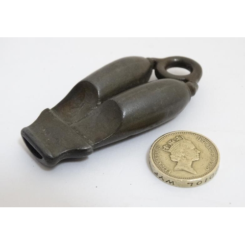 855 - An unusual c.1900 pewter double whistle with internal peas, with lanyard ring. 2 7/8'' long