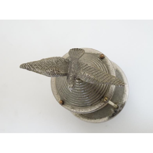 856 - A 20thC novelty desk bell in the form of a seabird above a buoy bears reg design number under 5 1/2'... 