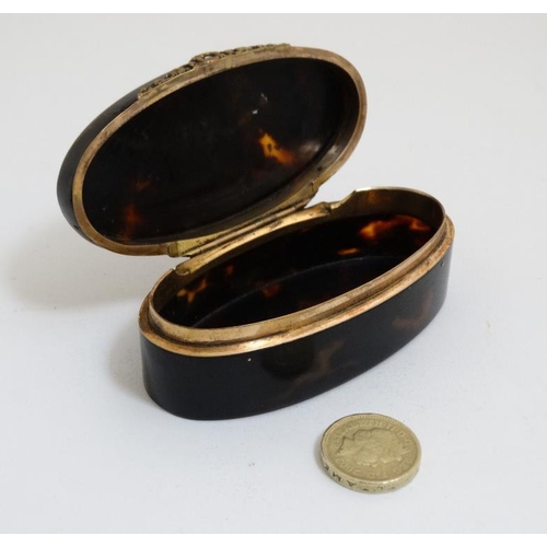 857 - A 19thC tortoiseshell silver inlaid hinged lidded box with silver gilt facings. 3 1/2'' long x 1 1/4... 