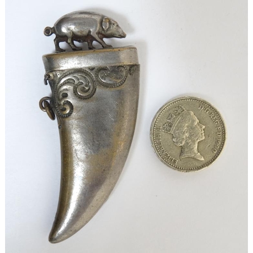 865 - An Anglo Indian nickel plated brass vesta / match holder formed as a stylised boar tooth, the hinged... 