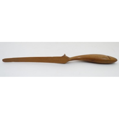 866 - Treen: A 19thC wooden letter / paper knife the handle formed as a fish. 10 1/4'' long