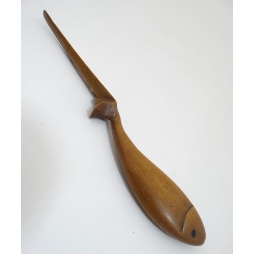 866 - Treen: A 19thC wooden letter / paper knife the handle formed as a fish. 10 1/4'' long