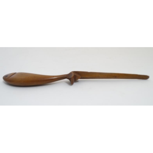 866 - Treen: A 19thC wooden letter / paper knife the handle formed as a fish. 10 1/4'' long