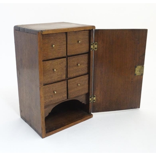 869 - A 19 thC mahogany 6 draw Spice Box with under tier storage closing door, measuring 12'' high