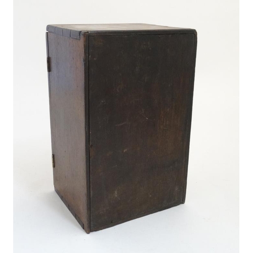 869 - A 19 thC mahogany 6 draw Spice Box with under tier storage closing door, measuring 12'' high