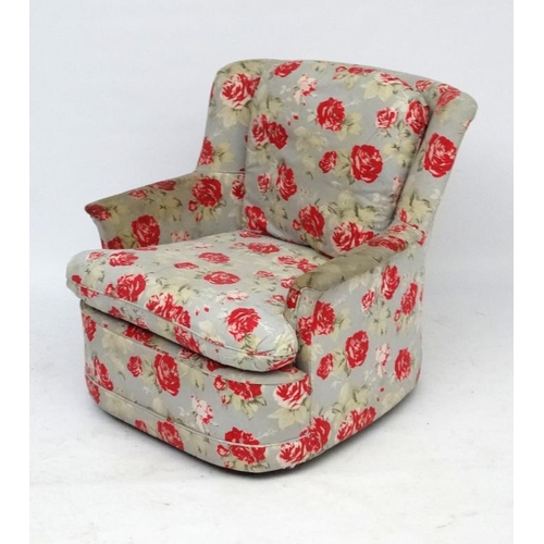 87 - A mid 20thC armchair with Cath Kidston style upholstery. 30 1/2'' high