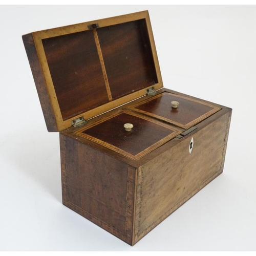 870 - A late 18thC Sheraton shell inlaid and cross banded mahogany tea caddy opening to reveal two lidded ... 