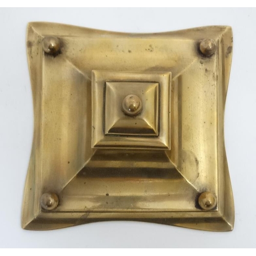 877 - A 19thC cast brass inkwell with pen rests, the centre hinging open to reveal glass lined inkstand. 6... 