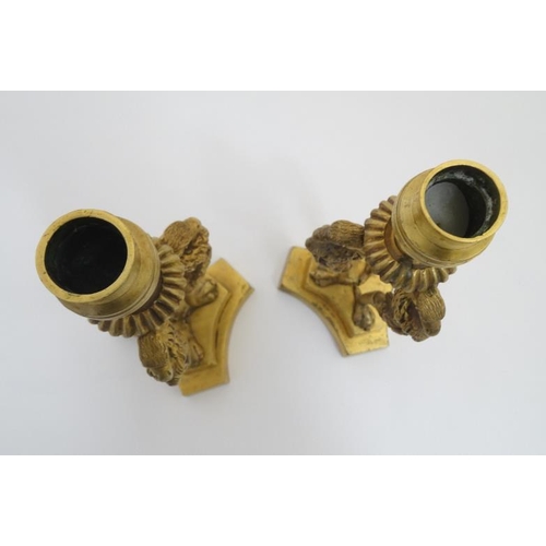 889 - A pair of Regency tri-form gilt brass candlesticks with three bird caryatids. 8 1/2'' high