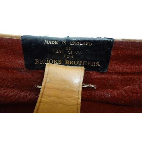 894 - A mid 20thC '' Brooks Brothers '' brown leather saddle shaped hat box with red silk lining , made by... 