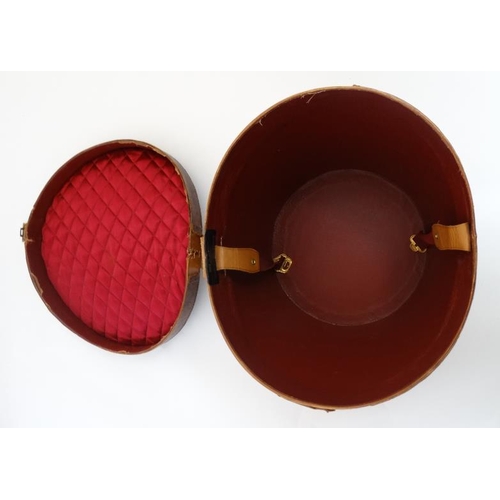 894 - A mid 20thC '' Brooks Brothers '' brown leather saddle shaped hat box with red silk lining , made by... 