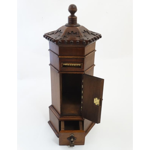 897 - A late 20thC Victorian style hexagonal shaped country house / hotel  wooden post box 22'' high