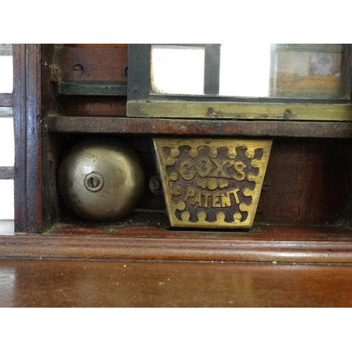 898 - A Victorian mahogany Cox's patent railway ticket office machine / till with brass fittings, fitted w... 