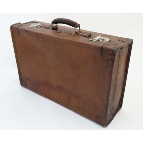 903 - A leather travelling case with watered green silk interior and pocket to lid 21 1/2'' wide