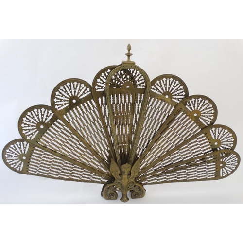 907 - A 20thC cast brass peacock tail Regency style fire screen, standing 24'' high