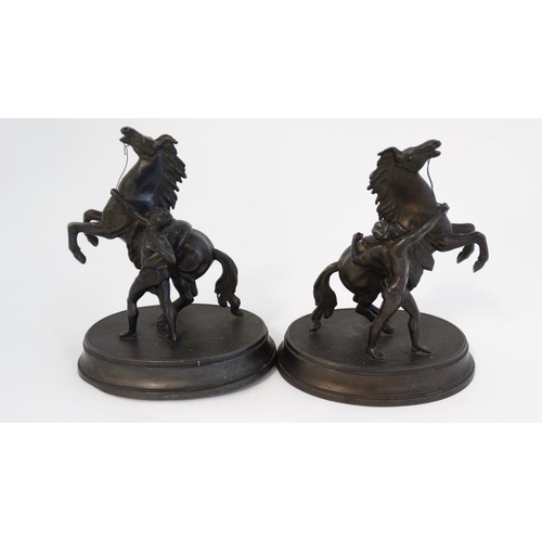 910 - Marley horseman : A  pair of Victorian spelter Marley Horseman figure groups on oval bases. 8 3/4'' ... 