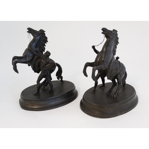 910 - Marley horseman : A  pair of Victorian spelter Marley Horseman figure groups on oval bases. 8 3/4'' ... 