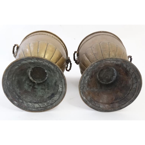 913 - A pair of early 20thC brass urn shaped jardinieres with green man mask handles to sides. 13 1/'''' h... 