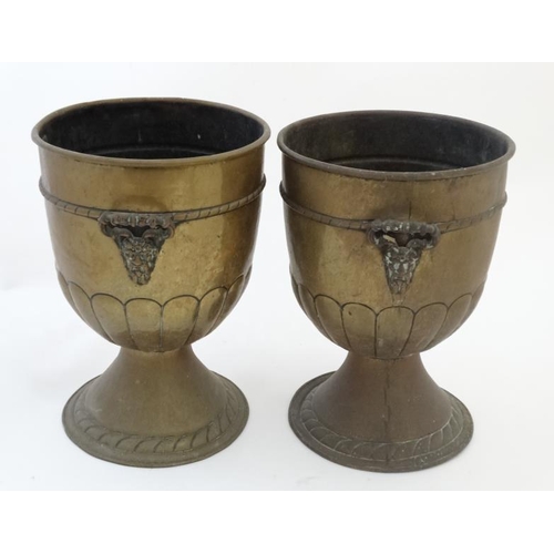 913 - A pair of early 20thC brass urn shaped jardinieres with green man mask handles to sides. 13 1/'''' h... 