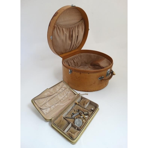 921 - Asprey Lodnon : A leather hat box with watered silk lining together with a velum jewellery box. 16''... 