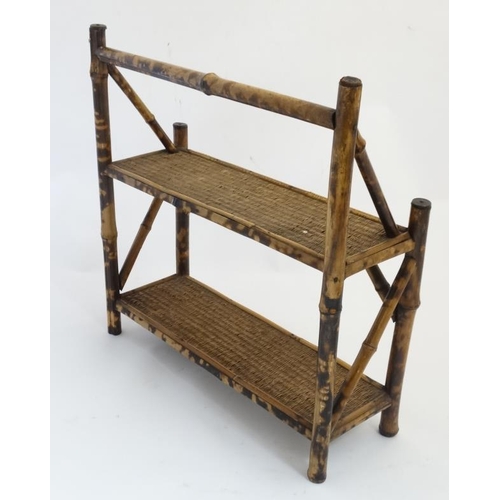 922 - A set of .1900 bamboo and rattan 2-tier three standing shelves. 19'' high x 18 3/4'' wide x 6 1/2'' ... 