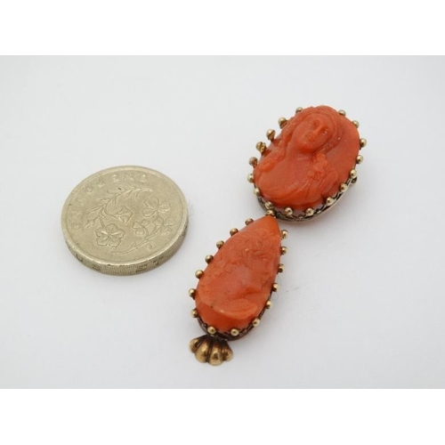 961 - A yellow metal brooch set with carved coral cameo like decoration with drop section under set with s... 