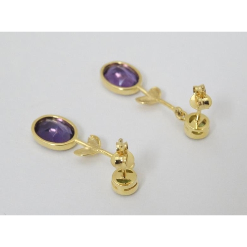 963 - A pair of silver gilt drop earrings set with amethysts and peridot 1 1/4'' long