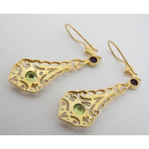 968 - A pair of silver gilt drop earrings set with amethysts peridot and seed pearls 1 3/4'' long