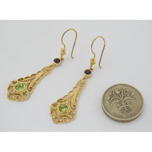 968 - A pair of silver gilt drop earrings set with amethysts peridot and seed pearls 1 3/4'' long