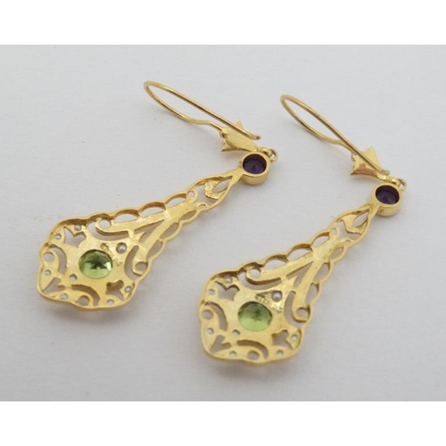 968 - A pair of silver gilt drop earrings set with amethysts peridot and seed pearls 1 3/4'' long