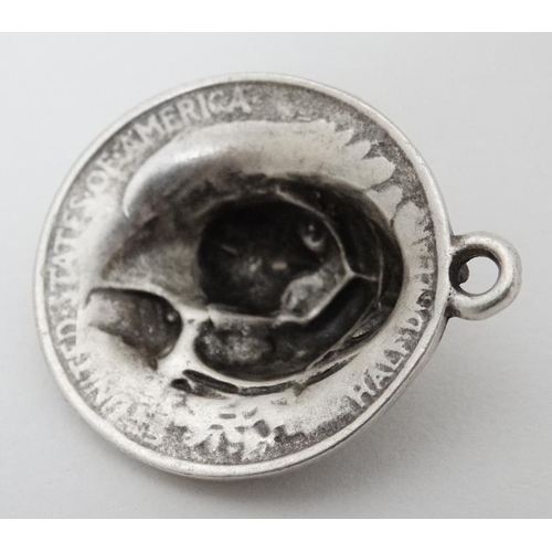 974 - A white metal pendant formed from a 1920 American half dollar  1 1/4'' long