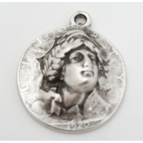 974 - A white metal pendant formed from a 1920 American half dollar  1 1/4'' long