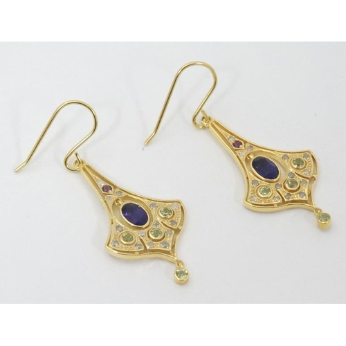 979 - A pair of silver gilt drop earrings set with amethyst, peridot and white stones. Approx 1 1/2'' long