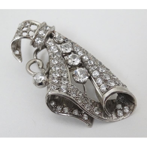 988 - A mid 20thC Palladium brooch set with white stones. For restoration. approx 2'' long