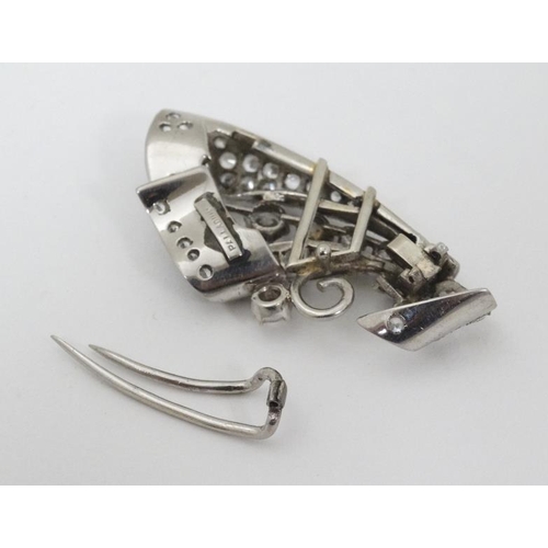 988 - A mid 20thC Palladium brooch set with white stones. For restoration. approx 2'' long