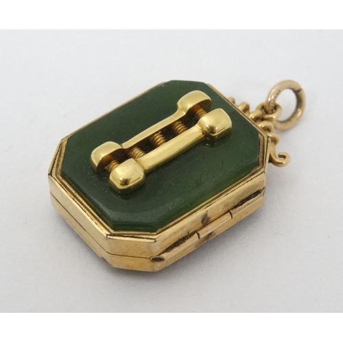 989 - Eugen Sandow Interest : A 9ct gold locket pendant set with pounamu ( New Zealand greenstone )  stone... 