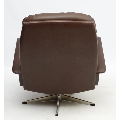 101 - Vintage Retro : A Danish brown leather open arm tilt and swivel button back chair , on a chromed 5 s... 