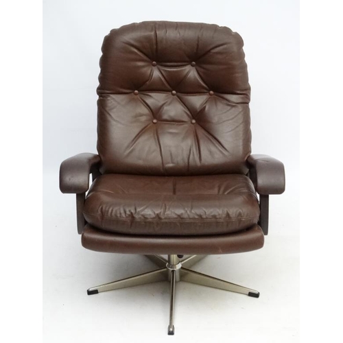 101 - Vintage Retro : A Danish brown leather open arm tilt and swivel button back chair , on a chromed 5 s... 