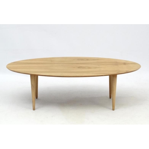 107 - Vintage Retro : an Afrormosia oval shaped coffee table with turned tapering beech legs , measuring 1... 