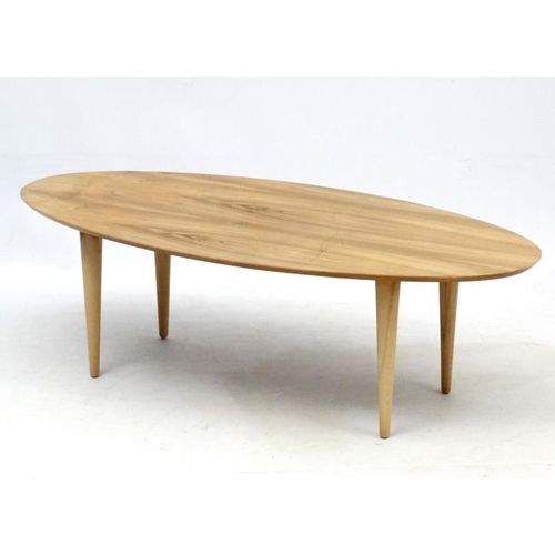 107 - Vintage Retro : an Afrormosia oval shaped coffee table with turned tapering beech legs , measuring 1... 