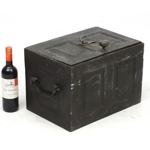 1093 - A Victorian cast iron strong box with handles , panelled sides and key. 17 5/8'' long x 12'' deep x ... 