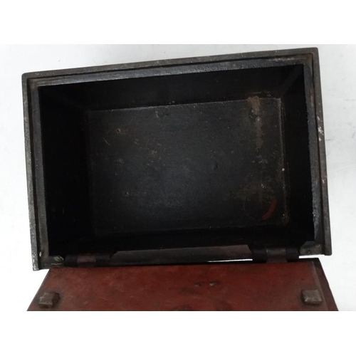 1093 - A Victorian cast iron strong box with handles , panelled sides and key. 17 5/8'' long x 12'' deep x ... 