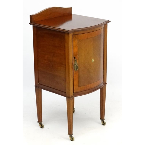 179 - An Edwardian inlaid and cross banded mahogany bow front bedside cabinet 16 3/4'' wide x 17'' deep st... 