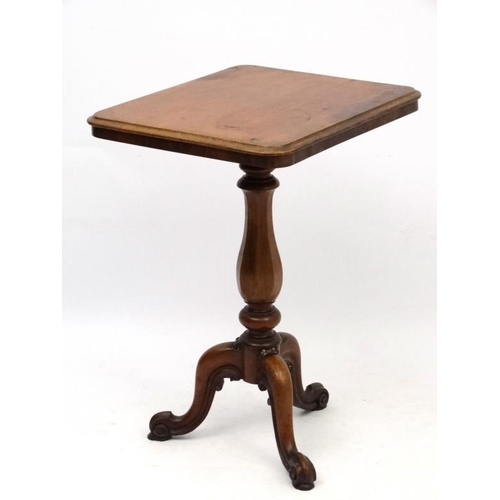 180 - A William IV mahogany tripod squared topped table with octagonal vase shaped pedestal. 21 1/2'' wide... 