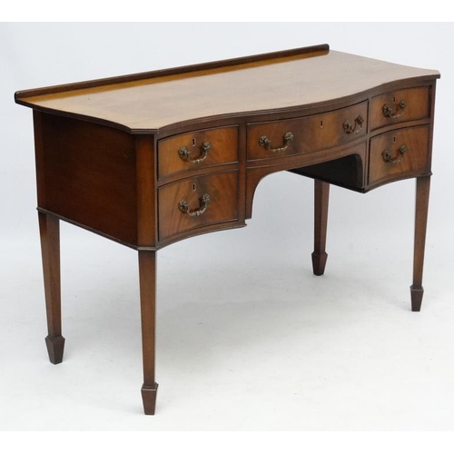 182 - A c.1900 mahogany serpentine shaped writing desk 21 3/4'' deep x 45 1/2'' wide x 30 1/2'' high  Plea... 