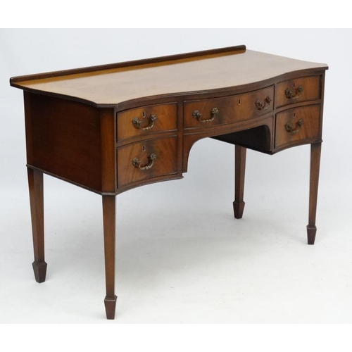 182 - A c.1900 mahogany serpentine shaped writing desk 21 3/4'' deep x 45 1/2'' wide x 30 1/2'' high  Plea... 