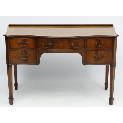 182 - A c.1900 mahogany serpentine shaped writing desk 21 3/4'' deep x 45 1/2'' wide x 30 1/2'' high  Plea... 