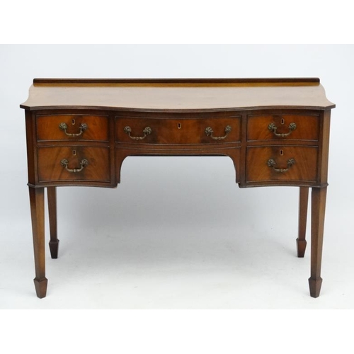 182 - A c.1900 mahogany serpentine shaped writing desk 21 3/4'' deep x 45 1/2'' wide x 30 1/2'' high  Plea... 